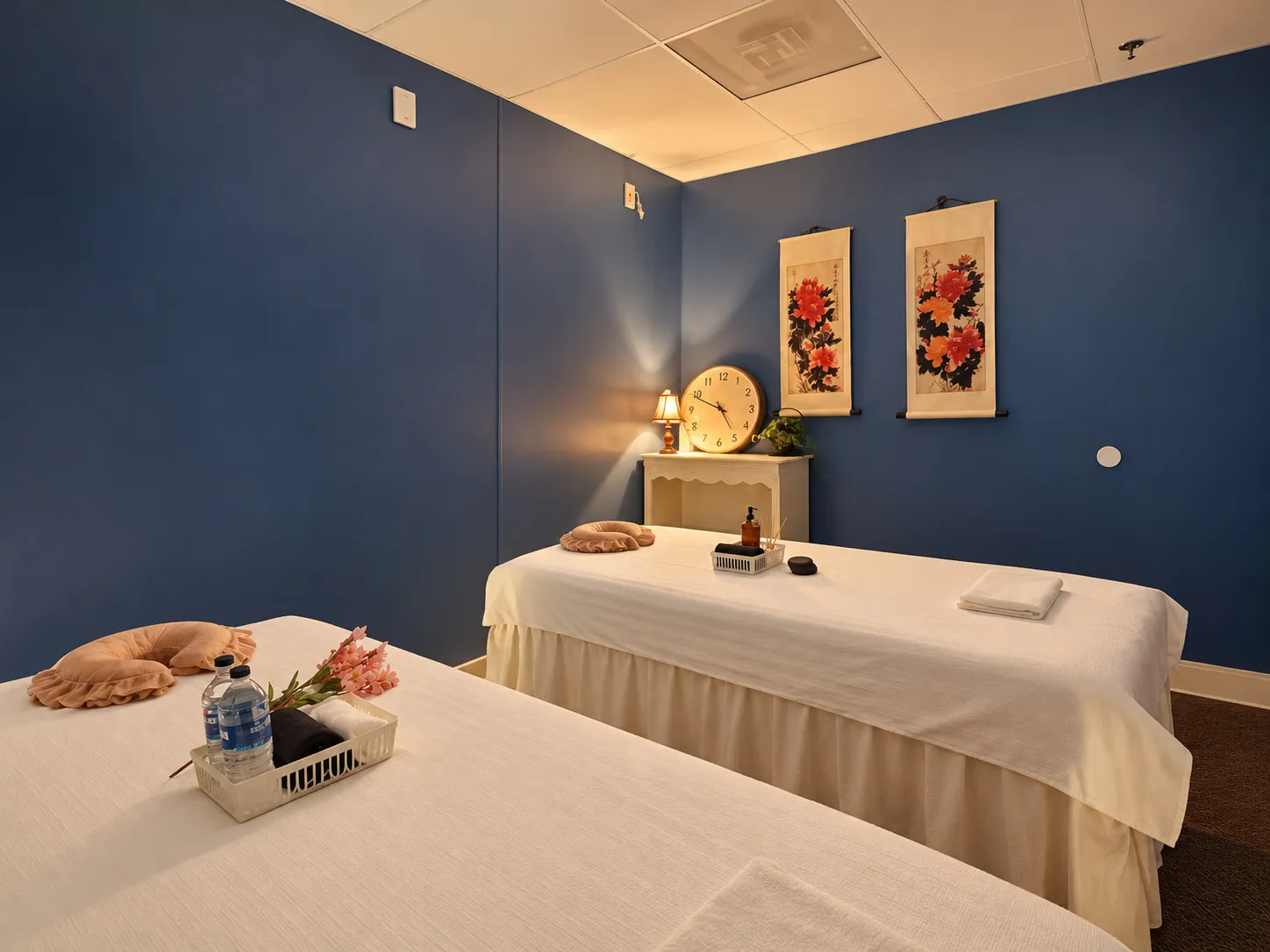 Couples room at Wellness Massage Spa in Gainesville, two massage tables side by side under warm light